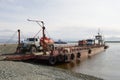 Unloading a car ferry on the Ob River