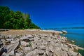 Lac Qui Parle State Park beach and rocks alongside the water Royalty Free Stock Photo