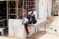 Unidentified Senegalese man sits on the massage table.