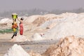 LAC ROSE, SENEGAL - NOVEMBER 13, 2019: People harvesting salt on Lac Rose or Lake Retba. Dakar. West Africa. UNESCO World Heritage