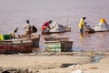 LAC ROSE, SENEGAL - NOVEMBER 13, 2019: People harvesting salt on Lac Rose or Lake Retba. Dakar. West Africa. UNESCO World Heritage