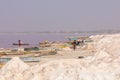 LAC ROSE, SENEGAL - NOVEMBER 13, 2019: People harvesting salt on Lac Rose or Lake Retba. Dakar. West Africa. UNESCO World Heritage