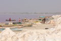 LAC ROSE, SENEGAL - NOVEMBER 13, 2019: People harvesting salt on Lac Rose or Lake Retba. Dakar. West Africa. UNESCO World Heritage