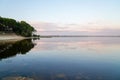 Lacanau lake sunrise with sandy beach forest in nature Gironde france Royalty Free Stock Photo