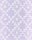 Fine white lace on violet background Royalty Free Stock Photo