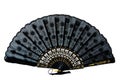 Lace black and gold hand fan isolated on white  background. Spanish or Chinese influence. Flamenco fan Royalty Free Stock Photo