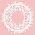 Lace frame on a pink background. Delicate round doily. Royalty Free Stock Photo