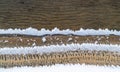 Lace patterns of the frozen water edge on the pond.