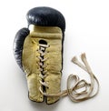 Lace Up Boxing Glove Lying on White Background Royalty Free Stock Photo