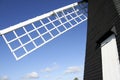 Lacey green windmill blue sky england Royalty Free Stock Photo