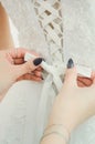 Lacing on the dress of the bride. Accessories, wedding image