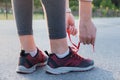 Lacing up running shoes. Close-up of woman hands that lace up tr Royalty Free Stock Photo