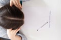 Lack of money and finances, panic during quarantine. Female hands hold their head over a sheet of paper with the inscription when Royalty Free Stock Photo