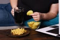 Lonely woman watch series drink beer eat junk food Royalty Free Stock Photo