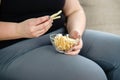 Fat woman overeating junk food. sedentariness Royalty Free Stock Photo