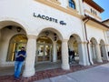 A Lacoste clothing retail store at an outdoor mall Royalty Free Stock Photo