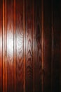 Lacquer varnish wooden panels. Dark brown natural wood background texture Royalty Free Stock Photo
