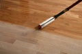 Lacquering wood floors. Worker uses a roller to coating floors Royalty Free Stock Photo