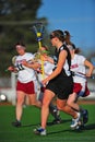 Lacrosse girls cradling the ball Royalty Free Stock Photo