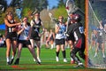 Lacrosse girls stop at the crease