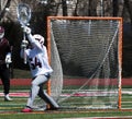 Lacrosse goalie stopping the ball Royalty Free Stock Photo