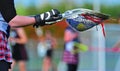 Lacrosse goalie stick with the game ball Royalty Free Stock Photo