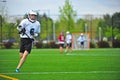 Lacrosse Player with the ball Royalty Free Stock Photo