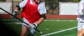 Lacrosse player running whith the ball during a scrimmage