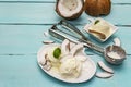 Lactose free coconut ice cream. Special spoon, halves of fruit, flakes