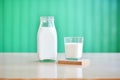 lactosefree milk carton and glass on a table