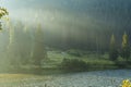 Lacul Rosu - Red Lake in a summer morning sunrise, the Carpathians, Romania