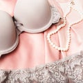 Lacy lingerie womens underwear on white background closeup on silk background