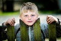 A lad of the village behind the fence