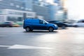 Lada largus car moving on the street. Estate vehicle driving along wet slippery street in city with blurred background Royalty Free Stock Photo