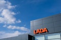 Vologda, Russia - May 3, 2020: modern lada dealership center building on a blue sky background with clouds. sign of a vehicle cen