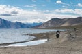 Riders at Pangong Lake view from Between Spangmik and Maan in Ladakh, Jammu and Kashmir, India