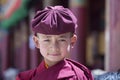 Happy young buddhist monk during Hemis Festival at Ladakh, North India, close up portrait