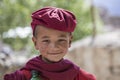 Happy young buddhist monk during Hemis Festival at Ladakh, North India, close up portrait