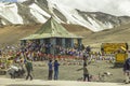 Alpine road and Buddhist temple with flags