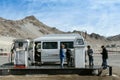 Ladakh, Leh, India - November 21, 2020 : travelers filling their car with petrol at indianoil gas station with mountain view and