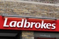 Ladbrokes logo on a wall