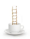 Ladder from coffee inside white cup