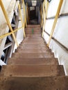 Ladder in the factory Stairs in the factory. Old factory wooden stairs.