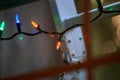 Ladder and christmas lights outside of a home window Royalty Free Stock Photo