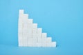 Ladder made of sugar on a blue background Royalty Free Stock Photo