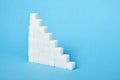 Ladder made of sugar on a blue background Royalty Free Stock Photo