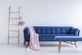 Ladder and navy blue sofa