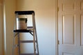 Ladder with paint can and brush Royalty Free Stock Photo
