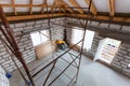 Ladder, parts of scaffolding and construction material on the floor during on the remodeling, renovation, extension, restoration, Royalty Free Stock Photo