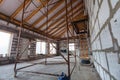 Ladder, parts of scaffolding and construction material on the floor during on the remodeling, renovation, extension Royalty Free Stock Photo